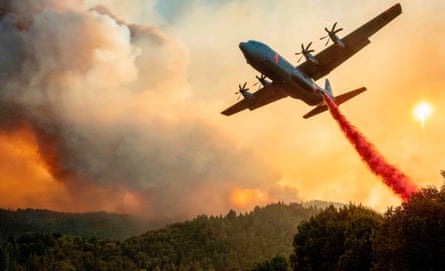 An aircraft drops fire retardant on a ridge during the Walbridge fire, part of the larger LNU Lightning Complex fire, in Healdsburg, California, on Thursday.