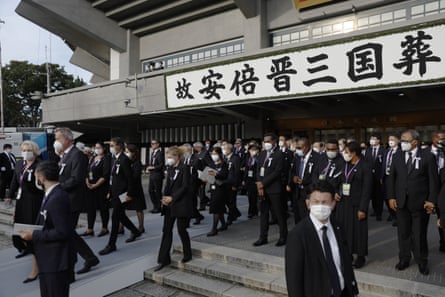 Attendees leave after the state funeral for former Japanese Prime Minister Shinzo Abe at the Nippon Budokan in Tokyo.