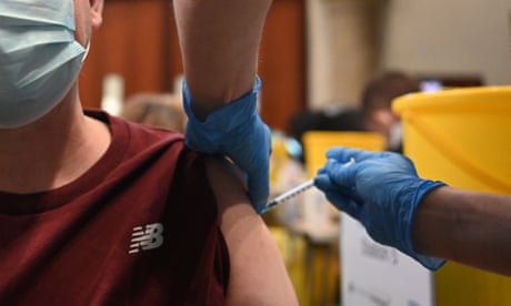 A man receives a Covid-19 booster jab