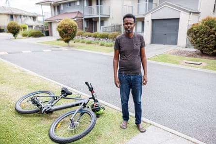 Abdirashid Farah Abdi photographed with his bike on a street near his home in Durack, Brisbane.