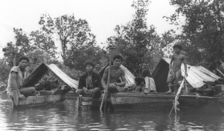 Archive photo of Orang Seletar Indigenous people on their sampans on the water in southern Malaysia.
