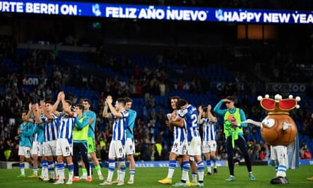 Real Sociedad’s players celebrate with the fans at full time