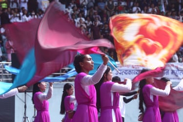 People wave coloured fabric at Dasarath Rangasala Stadium during Easter celebrations