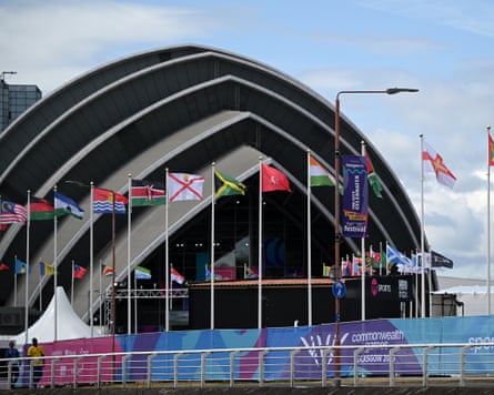 A stadium in Glasgow with flags from Commonwealth countries in front of it
