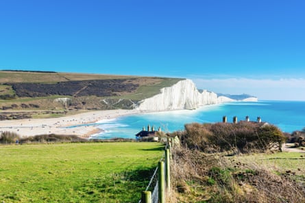 A view of Cuckmere Haven beach near Seaford, East Sussex, with the Seven Sisters cliffs behind