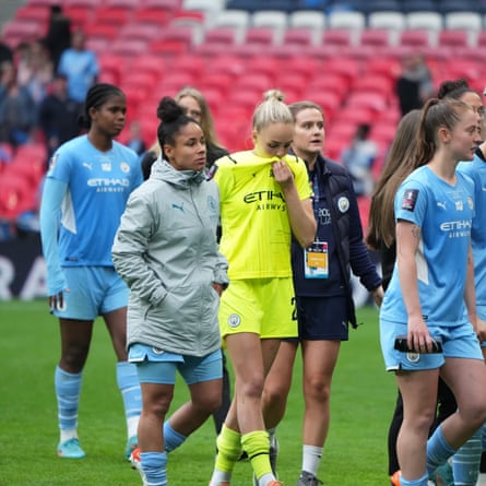 Manchester City goalkeeper Ellie Roebuck and her teammates are dejected after losing the FA Cup final.