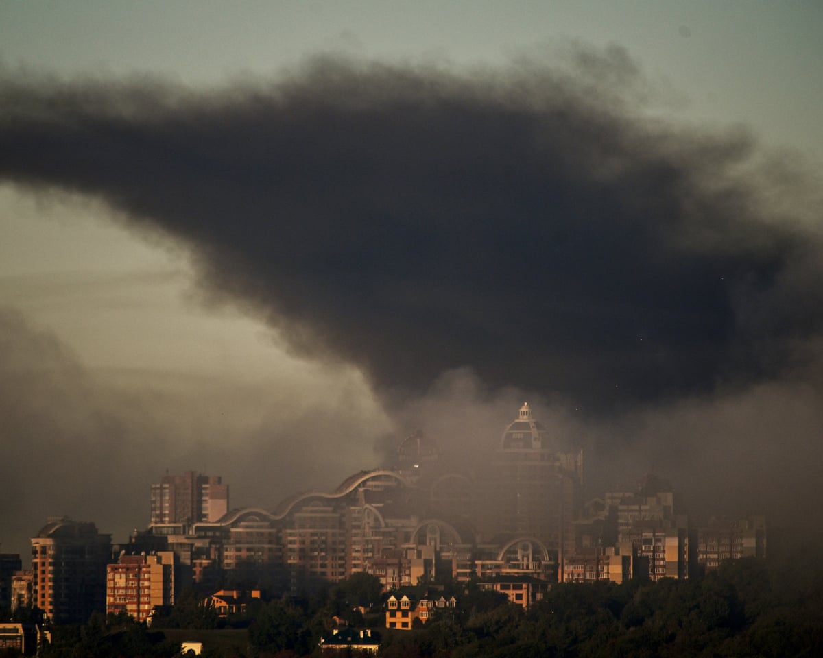 Smoke rises above residential buildings following an air attack in Kyiv.