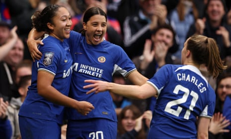 Lauren James celebrates with teammates Sam Kerr and Niamh Charles after scoring Chelsea's third goal and her second of the game.
