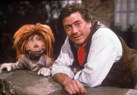 Llewellyn-Jones with a puppet in The Riddlers.