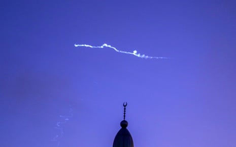 Traces of missiles are seen as Iran launches missile strike on Israel seen from Hebron, West Bank on June 24, 2025.