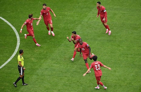 Portugal's Nuno Mendes celebrates scoring their second goal with Vitinha, Joao Cancelo, Pedro Neto, Ruben Dias and Cristiano Ronaldo.