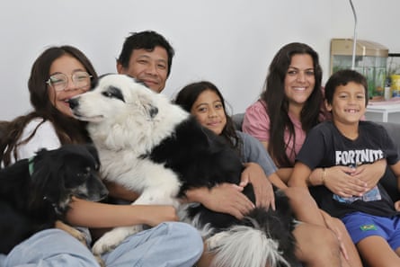 Maya, Bijay, Neha, Dorin and Ram Rai with their dogs