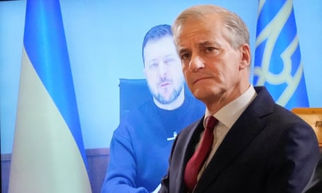 Jonas Gahr Støre in Oslo, Norway, with the Ukrainian president, Volodymyr Zelenskiy, appearing remotely