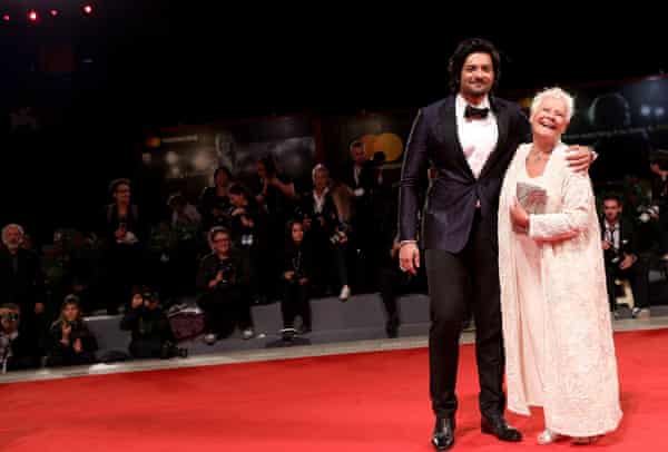 Dame Judi Dench and co-star Ali Fazal walk the red carpet before the Victoria and Abdul screening at the Venice film festival on Sunday.