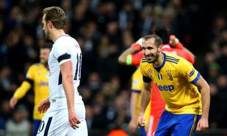 Giorgio Chiellini of Juventus smiles towards Tottenham’s Harry Kane after putting one over his old adversary.