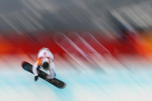 A photograph taken with a slow shutter speed shows Japan’s Raibu Katayama in action during the men’s snowboard halfpipe.
