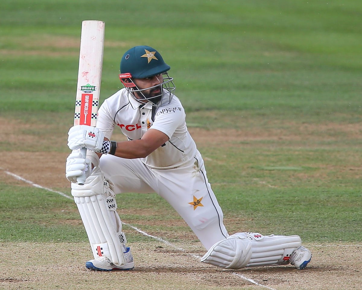 Saud Shakeel kneels to play a shot