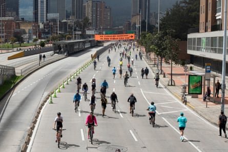 cyclists on a multi-lane road with no cars