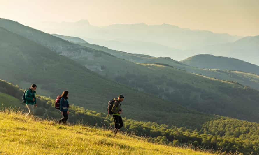 People traveling on a mountain slope