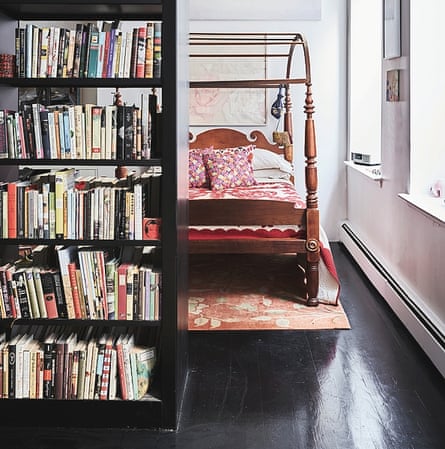 The bedroom behind the bookshelf.