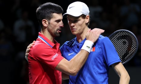 Jannik Sinner is congratulated by Novak Djokovic for his singles victory in the Davis Cup semi-final