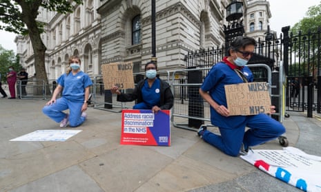 Nurses protest outside Downing Street, London in Jun 2020, highlighting a disproportionately high death rate among black and ethnic minority groups