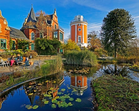 The Elisenturm tower sits next to a lily-covered pond in the Botanical Garden in Wuppertal