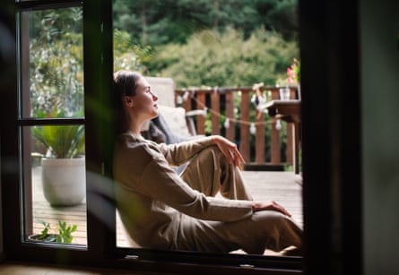 Woman rests in a doorway