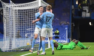 Phil Foden of Manchester City (left) celebrates scoring the second goal against Chelsea with Kevin de Bruyne.