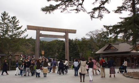 Visitors pass beneath the torii gate leading to the most sacred part of the Ise Jingu complex, Japan’s most revered Shinto shrine. 