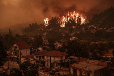 Pillars of billowing smoke and ash are blocking out the sun above Evia, Greece’s second-largest island, in 2021.