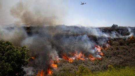 Aerial view of brush fire spreading across Simi Valley landscape