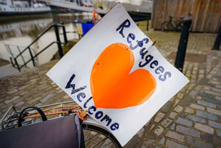 File photo dated 21/03/22 of a ‘refugees welcome’ banner attached to a bicycle by Bristol harbour