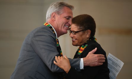 Kevin McCarthy hugs Bass during a ceremony to commemorate the 400th anniversary of the arrival of enslaved Africans in the US.