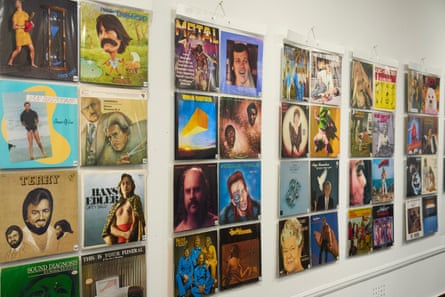 Collection of terrible album covers displayed on a wall at the Mansfield Museum