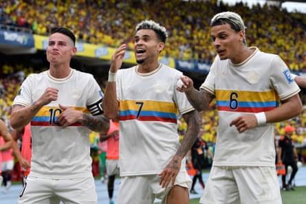 Luis Diaz of Colombia (C) celebrates with teammates James Rodriguez (L) and Richard Rios after scoring the team's second goal during the FIFA World Cup 2026 South American Qualifier match between Colombia and Chile at Roberto Melendez Metropolitan Stadium on October 15, 2024 in Barranquilla, Colombia.