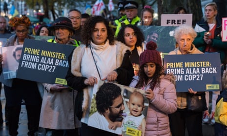 Mona Seif (centre), one of Abd el-Fattah’s sisters, at a candlelight vigil outside Downing Street on Sunday.