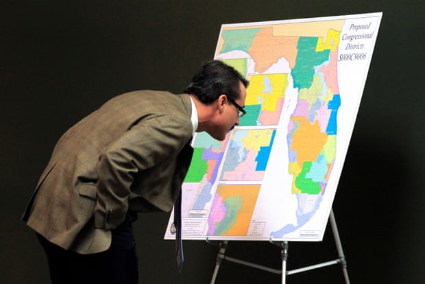 Florida state Sen. Rene Garcia looks at a map for proposed changes in congressional districts during a January 2012 state senate committee meeting.