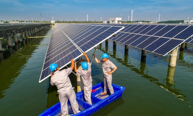 Workers at solar power station