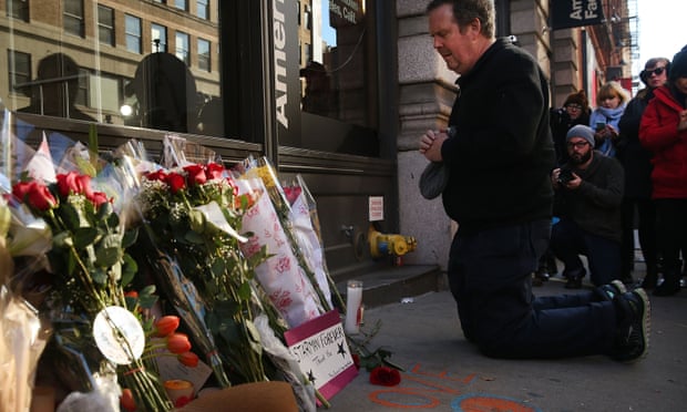 A man pays his last respects to Bowie outside the star’s New York apartment building.