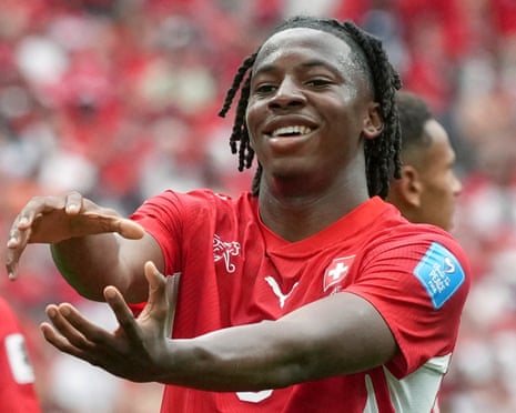 Johan Manzambi celebrates after scoring for Switzerland against Canada at the World Cup.
