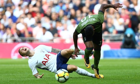 Tottenham’s Kieran Trippier is injured by a challenge from the Juventus defender Alex Sandro at Wembley