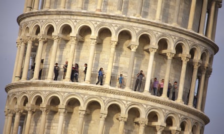 Tourists visit the leaning tower of Pisa