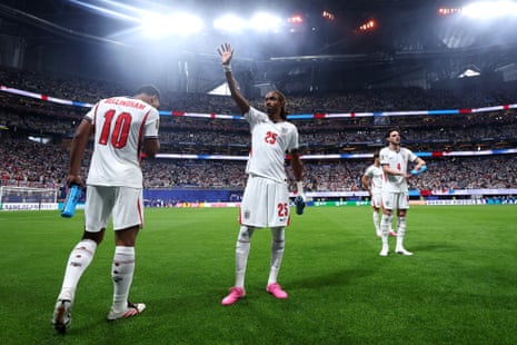 Djed Spence of England waves as he prepares for kick off.