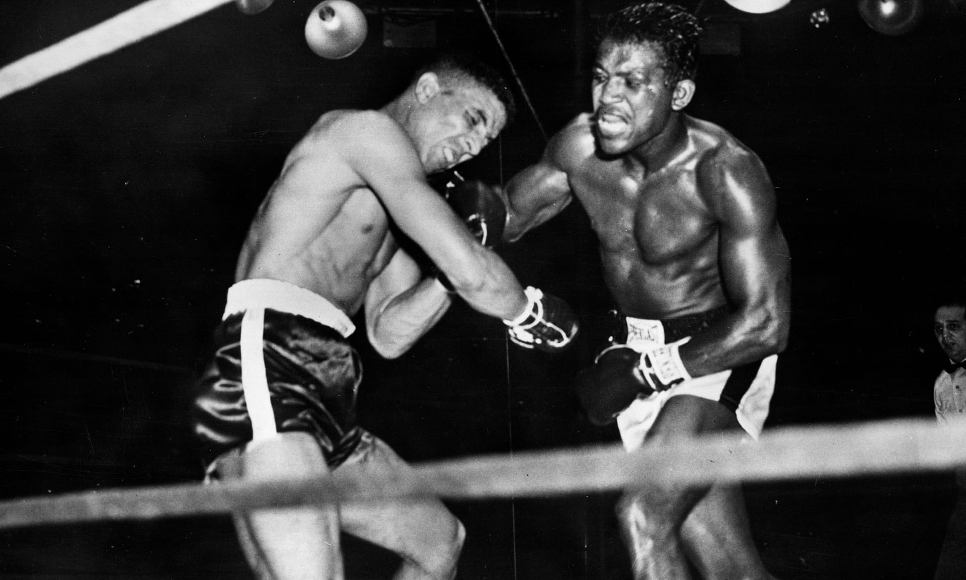 Randolph Turpin buckles under a blow from Sugar Ray Robinson during their world middleweight title fight in New York. Photograph: Hulton Archive/Getty Images