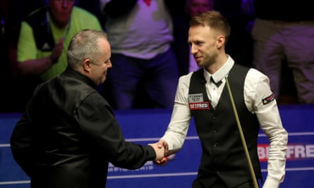 John Higgins (left) was unable to keep pace with Judd Trump’s superb final display.