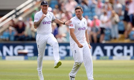 Jamie Overton celebrates with Ben Stokes after taking the wicket of New Zealand's Tom Latham