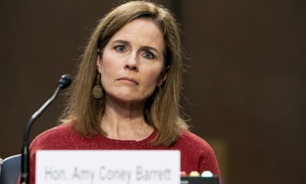Amy Coney Barrett listens during a confirmation hearing.
