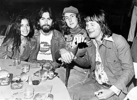 Idle with (from left) Olivia Arias, George Harrison and Terry Gilliam at the premiere of Monty Python and the Holy Grail, in Hollywood, July 1975.