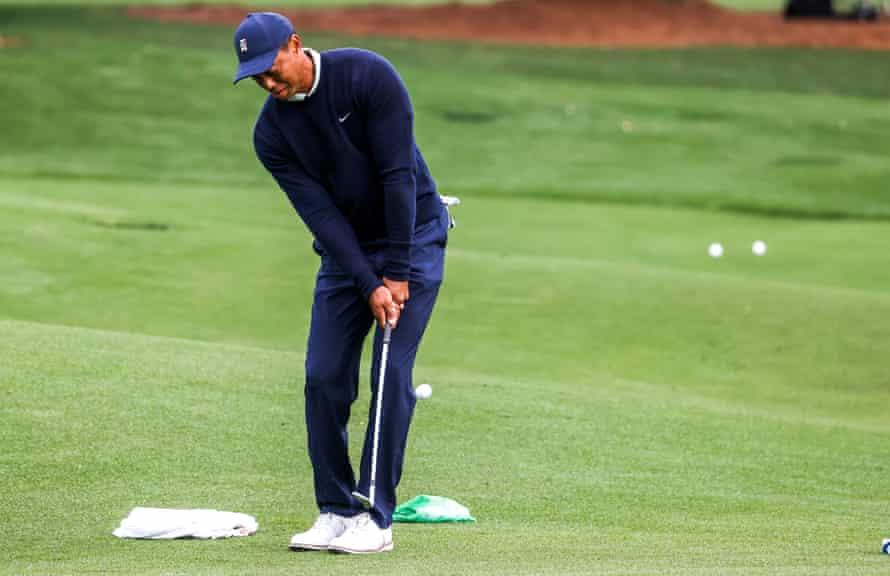 Woods warms up for this year's Masters at Augusta National.